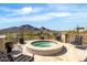 Outdoor hot tub area overlooking a scenic mountain view; perfect for relaxation and entertaining at 7046 N 59Th Pl, Paradise Valley, AZ 85253