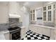 Charming kitchen features custom cabinets, marble countertops, and stainless steel appliances at 7046 N 59Th Pl, Paradise Valley, AZ 85253