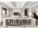 A gourmet kitchen featuring a large marble island, custom cabinets, and high-end appliances at 7046 N 59Th Pl, Paradise Valley, AZ 85253