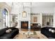 Beautiful living room with detailed trim, large fireplace and well-appointed seating, creating a cozy ambiance at 7046 N 59Th Pl, Paradise Valley, AZ 85253