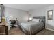 Bedroom featuring modern decor, wood-look floors, and side table with lamp at 7625 E Camelback Rd # A114, Scottsdale, AZ 85251