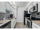 Kitchen featuring stainless steel appliances, granite countertops, and ample cabinet space at 7625 E Camelback Rd # A114, Scottsdale, AZ 85251