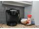 There is a Keurig coffee maker and accessories on the granite kitchen counter at 7625 E Camelback Rd # A114, Scottsdale, AZ 85251