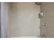 Bathroom features shower with tiled walls and showerhead at 7625 E Camelback Rd # A114, Scottsdale, AZ 85251
