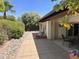Backyard featuring an expansive patio area, low-maintenance landscaping, and mature trees at 8552 E Vía Del Palacio --, Scottsdale, AZ 85258