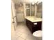 Bathroom with tiled shower, dark wood vanity, and neutral countertops at 8552 E Vía Del Palacio --, Scottsdale, AZ 85258