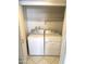 Laundry room featuring a white washing machine, dryer, and overhead storage at 8552 E Vía Del Palacio --, Scottsdale, AZ 85258