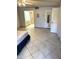 Spacious main bedroom featuring tiled floors, a ceiling fan, and convenient access to the en suite bathroom at 8552 E Vía Del Palacio --, Scottsdale, AZ 85258