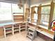 Workspace featuring multiple windows, custom shelving, and ample natural light at 8552 E Vía Del Palacio --, Scottsdale, AZ 85258