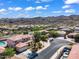 Aerial view of a quiet neighborhood with desert landscaping and mountain views at 8817 S 13Th Way, Phoenix, AZ 85042