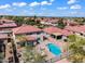 Aerial view of a home with a pool, hot tub, and landscaped yard in a beautiful neighborhood at 8817 S 13Th Way, Phoenix, AZ 85042