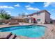 Spacious backyard showcasing a pool, patio, and landscaped surroundings for outdoor enjoyment at 8817 S 13Th Way, Phoenix, AZ 85042