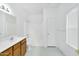 Bathroom features wood cabinets, tile flooring, and a tub and shower at 8817 S 13Th Way, Phoenix, AZ 85042