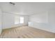 Carpeted bedroom with neutral walls and a large window at 8817 S 13Th Way, Phoenix, AZ 85042