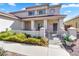 Home with an inviting front porch featuring stately columns, a decorative fountain, and a charming gated entrance at 8817 S 13Th Way, Phoenix, AZ 85042