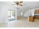 Bright eat-in kitchen with tile flooring, island, pantry, stainless steel refrigerator, and patio access at 8817 S 13Th Way, Phoenix, AZ 85042
