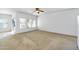 Bright and airy living room with large windows and neutral carpeting at 8817 S 13Th Way, Phoenix, AZ 85042