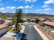 Street view of a home showcasing beautiful landscaping and a peaceful neighborhood setting at 8817 S 13Th Way, Phoenix, AZ 85042