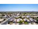 Suburban aerial shot showcasing manicured lawns, mature trees, and diverse home styles within a well-planned community at 9511 E Kiva Ave, Mesa, AZ 85209