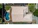 Aerial view of a home featuring a refreshing pool, lush lawn, and well-maintained tile roof at 9511 E Kiva Ave, Mesa, AZ 85209
