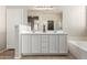 Bright bathroom features a double sink vanity, decorative lighting, and a glass shower at 9511 E Kiva Ave, Mesa, AZ 85209
