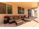 Covered patio with comfortable seating with view of the backyard at 9511 E Kiva Ave, Mesa, AZ 85209