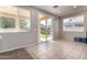 Bright dining area with sliding doors leading to a well-maintained backyard at 9511 E Kiva Ave, Mesa, AZ 85209