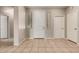 Bright foyer with tile flooring, neutral walls, and view into adjacent rooms through open doorways at 9511 E Kiva Ave, Mesa, AZ 85209