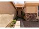 Inviting front entrance with a pathway leading to the front door and decorative stone accents at 9511 E Kiva Ave, Mesa, AZ 85209