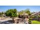 Well-kept home featuring desert landscaping, mature shade trees and a charming exterior at 9511 E Kiva Ave, Mesa, AZ 85209