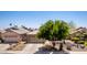 Charming single-story home with a well-maintained front yard and mature shade tree in a Gathering-friendly neighborhood at 9511 E Kiva Ave, Mesa, AZ 85209