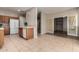Kitchen view featuring wood cabinetry and neutral tile flooring at 9511 E Kiva Ave, Mesa, AZ 85209