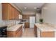 Charming kitchen with tile counters and stainless steel appliances at 9511 E Kiva Ave, Mesa, AZ 85209