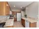 Kitchen with tile countertops, oak cabinets and white appliances at 9511 E Kiva Ave, Mesa, AZ 85209