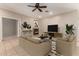 Inviting living room with fireplace, TV, and comfortable seating arrangement perfect for relaxation and entertainment at 9511 E Kiva Ave, Mesa, AZ 85209