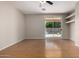 Open living room features sliding doors to the private swimming pool at 9511 E Kiva Ave, Mesa, AZ 85209