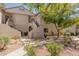 Well-maintained building exterior with manicured landscaping and inviting walkways, enhancing curb appeal at 9555 E Raintree Dr # 1018, Scottsdale, AZ 85260