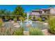 Scenic water fountain surrounded by lush greenery and decorative rocks, creating a serene atmosphere at 9555 E Raintree Dr # 1018, Scottsdale, AZ 85260