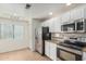 Well-lit kitchen equipped with stainless steel appliances, sleek countertops, and ample storage at 9555 E Raintree Dr # 1018, Scottsdale, AZ 85260