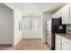 Bright kitchen showcasing a window, stainless steel appliances, and granite counters with ample natural light at 9555 E Raintree Dr # 1018, Scottsdale, AZ 85260