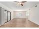 Large living room with ceiling fan, sliding glass door, and neutral paint at 9555 E Raintree Dr # 1018, Scottsdale, AZ 85260