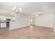Bright, open living space with tile floors leading into kitchen with stainless steel appliances at 9555 E Raintree Dr # 1018, Scottsdale, AZ 85260
