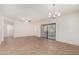 Open living room with sliding glass doors, ceiling fan, and neutral paint at 9555 E Raintree Dr # 1018, Scottsdale, AZ 85260
