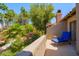 Relaxing balcony with a lounge chair and views of lush landscaping and a refreshing pool at 10017 E Mountain View Rd # 1087, Scottsdale, AZ 85258