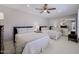 Comfortable bedroom with two beds, ample closet space, and a ceiling fan for added comfort at 10017 E Mountain View Rd # 1087, Scottsdale, AZ 85258