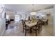 Bright dining room featuring a modern chandelier and open access to living room at 10017 E Mountain View Rd # 1087, Scottsdale, AZ 85258