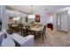 Open dining room with modern lighting and a large decorative mirror at 10017 E Mountain View Rd # 1087, Scottsdale, AZ 85258
