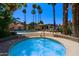 View of a hot tub and pool area with lounge chairs and desert landscaping at 10017 E Mountain View Rd # 1087, Scottsdale, AZ 85258