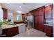 Gourmet kitchen with island seating and stainless steel appliances at 10017 E Mountain View Rd # 1087, Scottsdale, AZ 85258