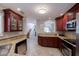 Well-equipped kitchen featuring granite countertops and wooden cabinets at 10017 E Mountain View Rd # 1087, Scottsdale, AZ 85258